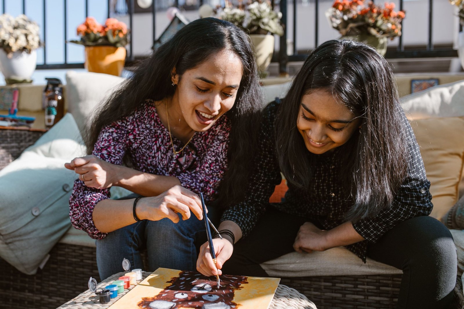 A mother and daughter enjoying a creative art and painting session together